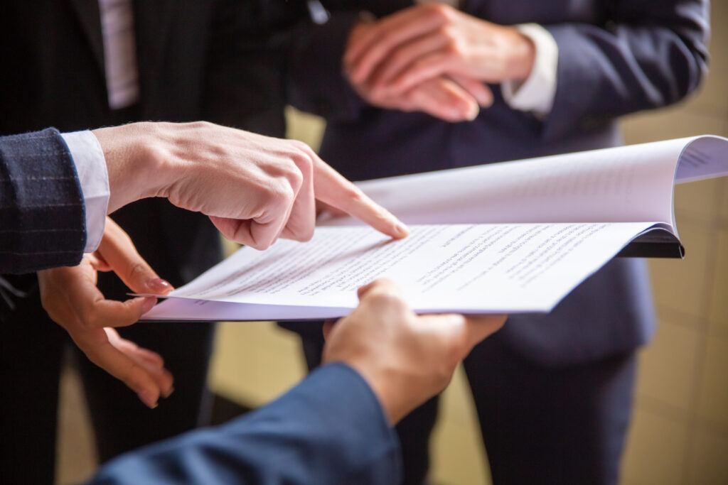 Foreign investors reading property ownership regulations of Dubai