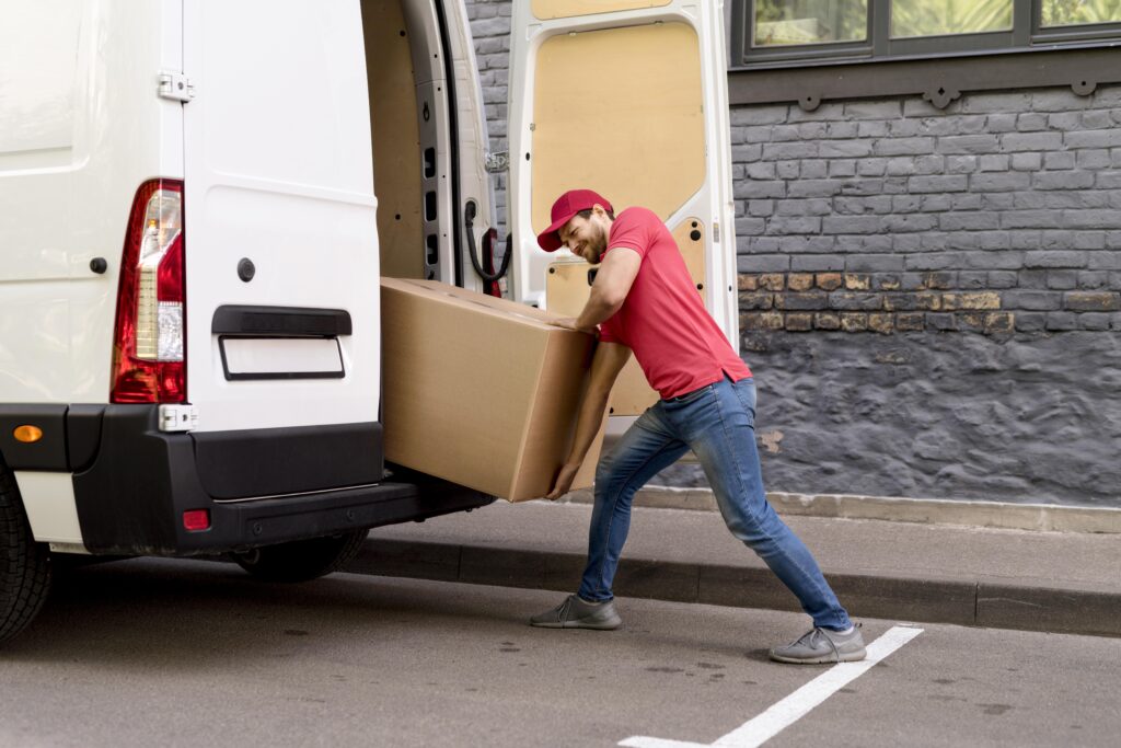 delivery man unloading furniture to a new house in Dubai